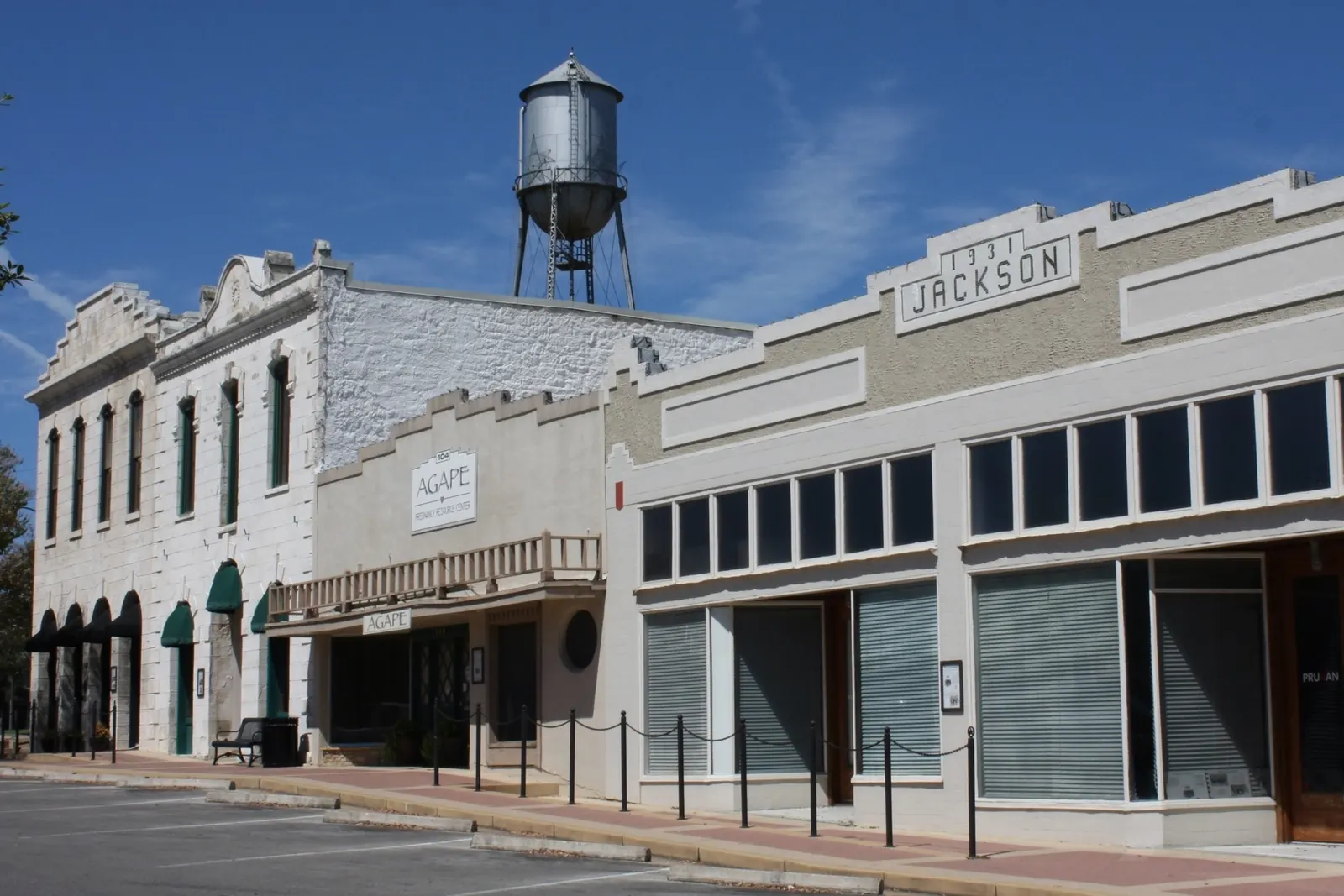 Historic storefronts and the water tower in downtown Round Rock